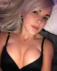 NYC street scene with people and city lights at dusk.